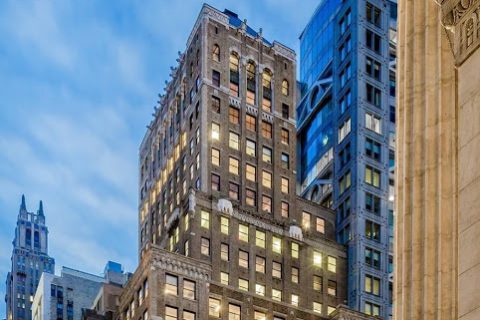 Newmark brokers penthouse office lease at 475 Fifth